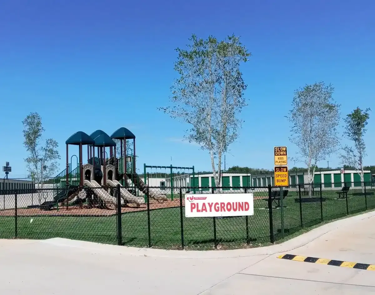 Fenced playground with slides